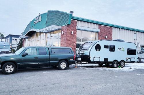 Tow vehicle and camper in front of Safari Condo in the morning.
