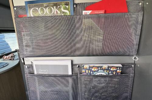 Books and magazines in a mesh organizer