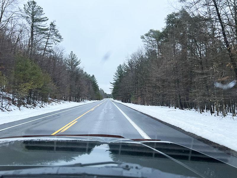 Driving through a snowy landscape.