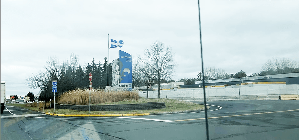 welcome to Quebec flag and sign