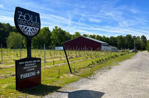 Exterior of Zoll Vineyards showing the winery and sign.